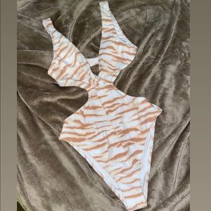 One piece swimsuit from Forever 21. Never worn, it’s too small for me.